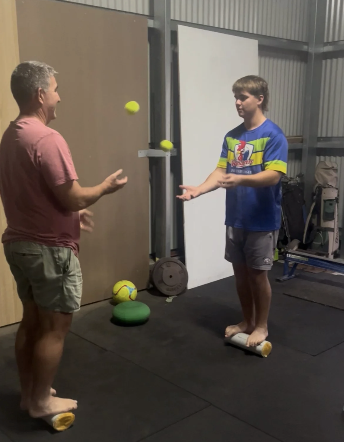Grant Bignell coaching a young athlete through balance and juggling skill work